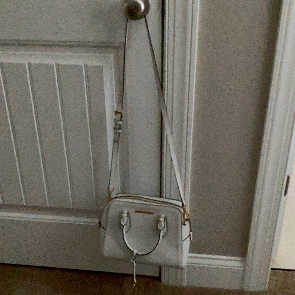 Michael Kors white satchel crossbody purse.